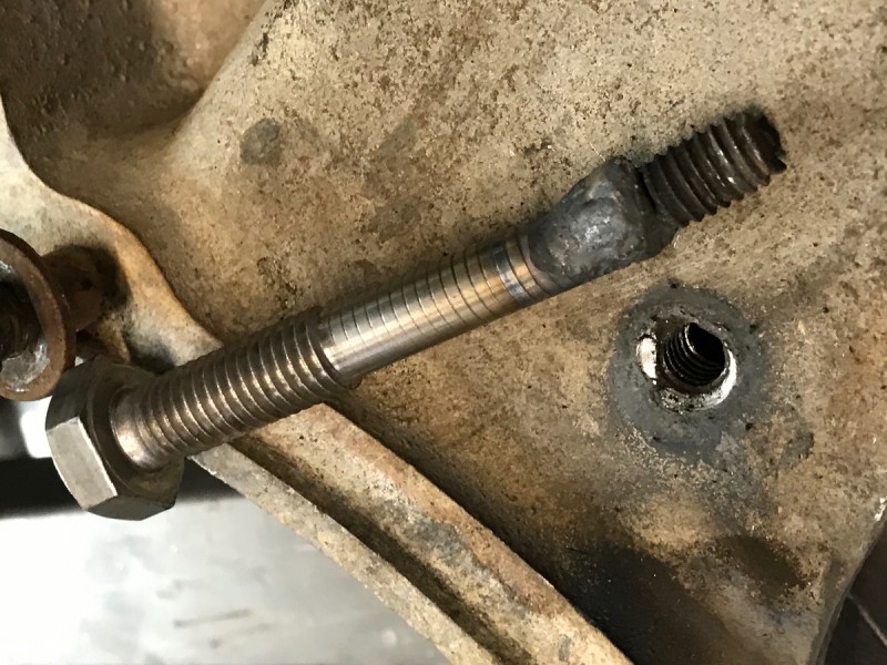 I sometimes weld a donor bolt to damaged studs if struggling to drill out, the heat from the tig weld helps release old threads