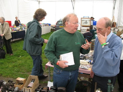 Gene &amp; Phillip examine the wares and chat with one vendor who had a box of pre-war bits at his stall.